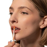 Fitglow rose lip serum on model