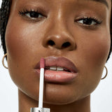 Fitglow muted rose lip serum on model