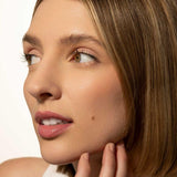 Fitglow nude rose lip serum on model