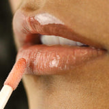 Fitglow beach glow lip serum on model