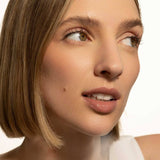 Fitglow brown nude lip serum on model