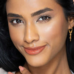 Fitglow carotene peach lip gloss on model