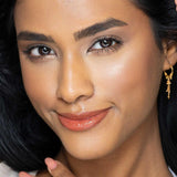 Fitglow carotene peach lip gloss on model