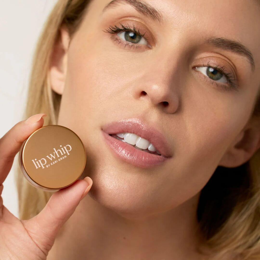 Model holding Kari Gran peptide lip whip