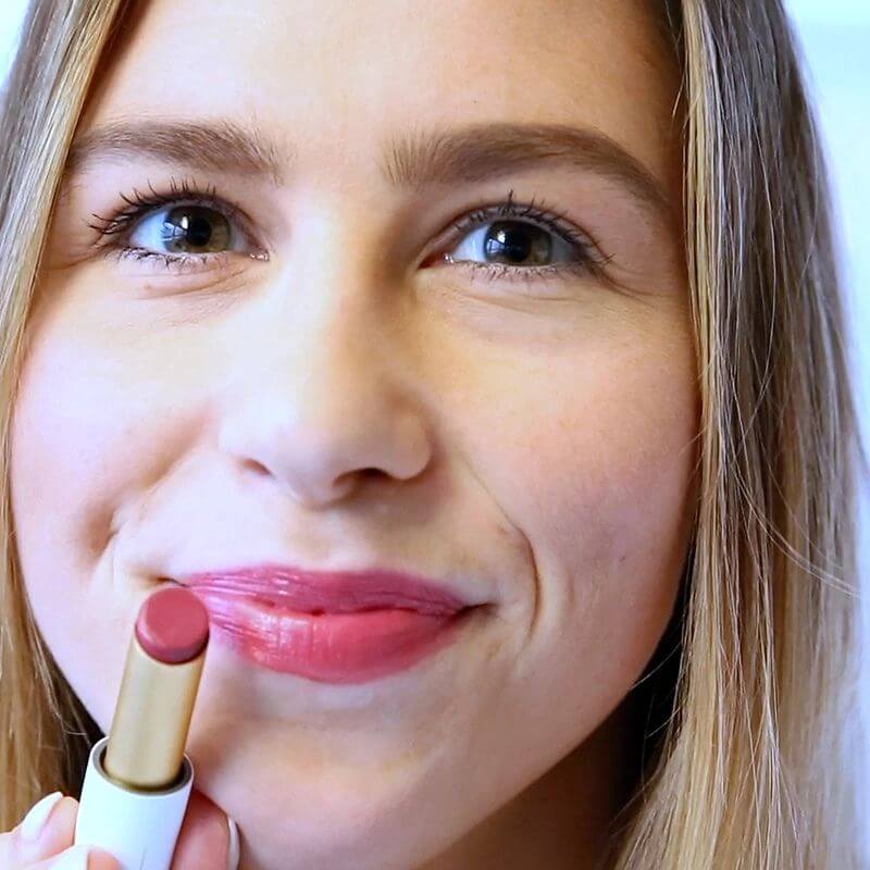 model wearing rich pink lipstick