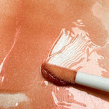 Sheer bronze shimmer lip gloss