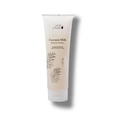 Tube of 100% Pure coconut milk shampoo on a white background