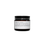 Jar of Among The Flowers calming body balm with a black lid on a white background