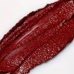 Close-up of Axiology True lipstick swatch on a white background