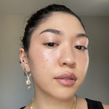 Close-up of a person wearing Axiology The Goodness