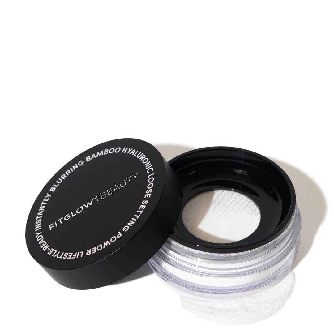Open container of Fitglow Beauty loose powder on a white background