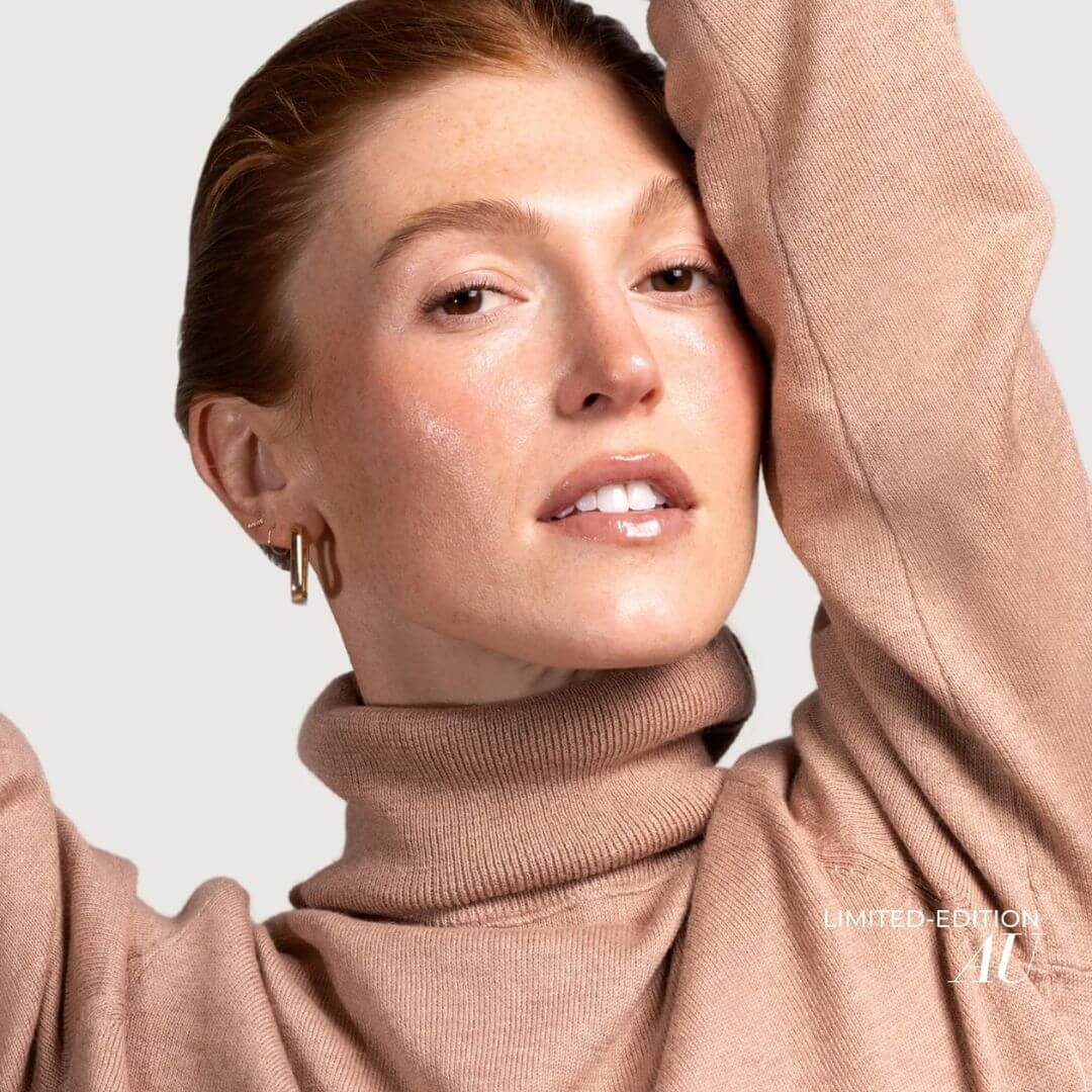 Woman wearing Fitglow Lip Gloss in shade AU