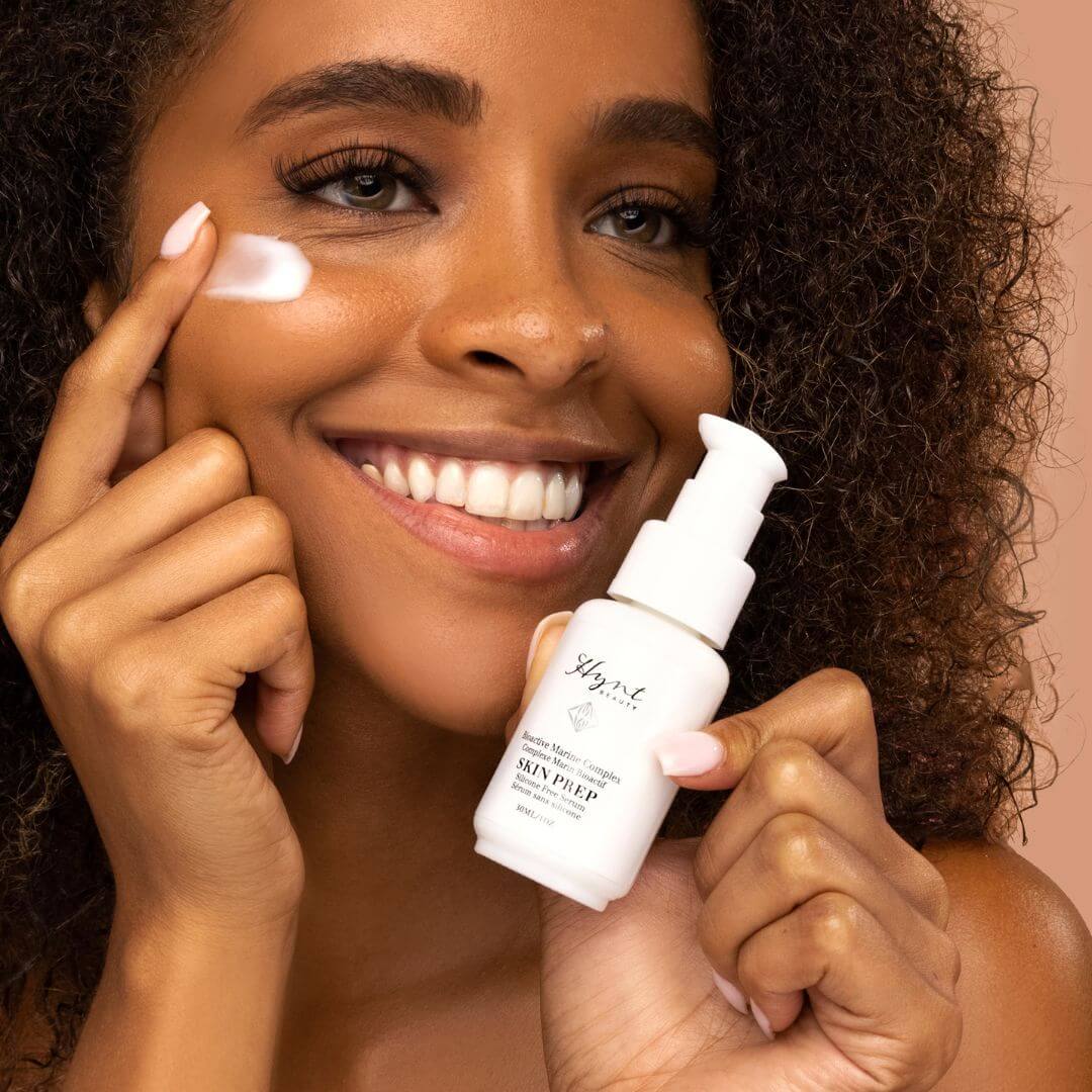 Woman applying Hynt Beauty Skin Prep Serum product to her face