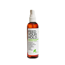 Bottle of 'Feed Your Hold' hair spray on a white background