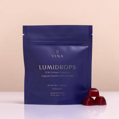 Yina Lumidrops package with gummies on a beige background