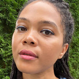 Woman wearing axiology joy multi stick on lips