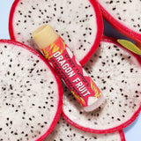 Crazy Rumors Dragon Fruit Lip balm  on slices of dragon fruit with a blue background