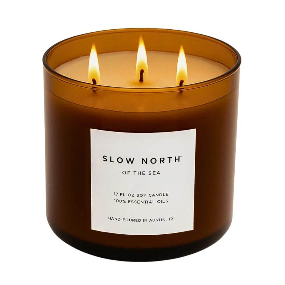 Brown candle with 'Slow North' label on a white background