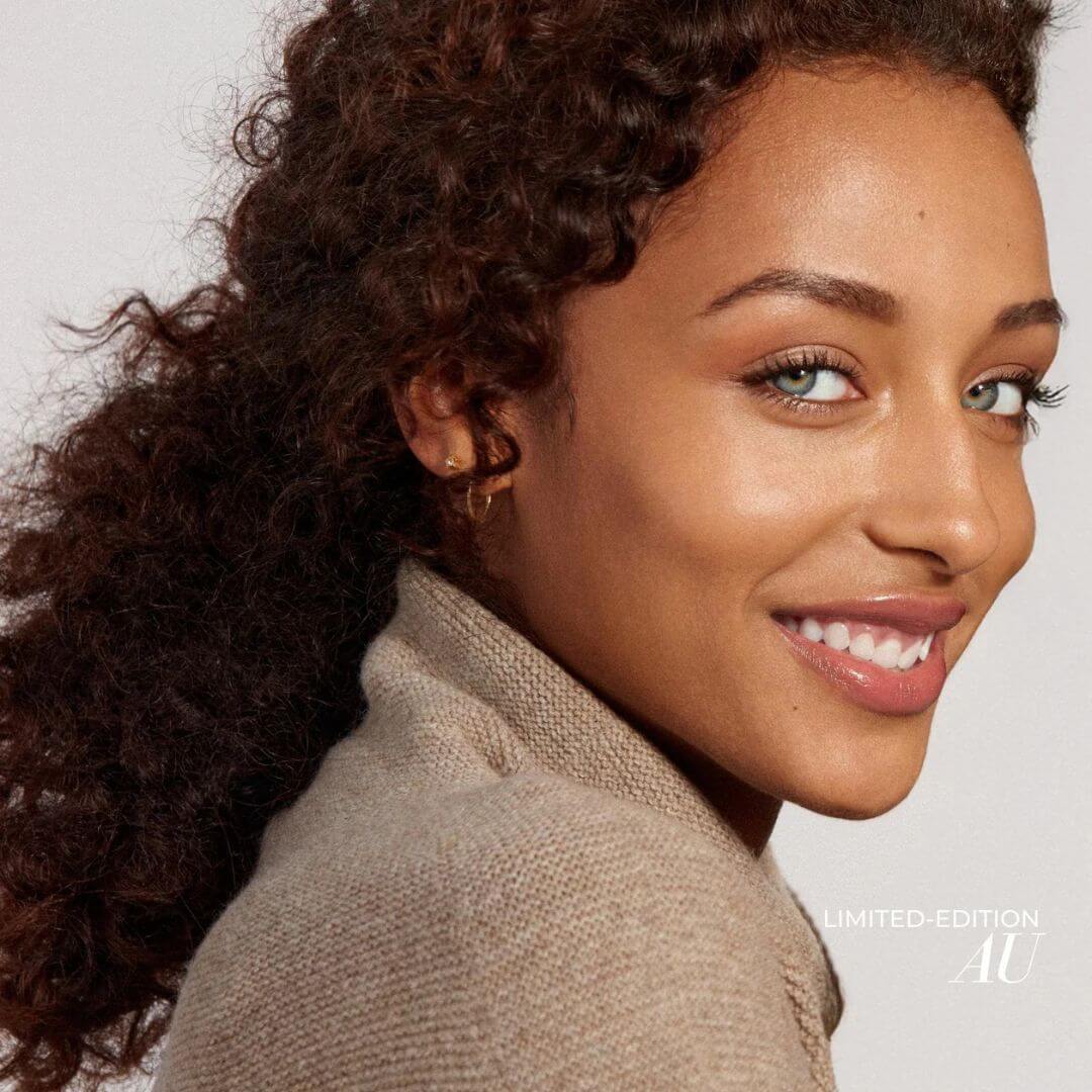 Woman wearing fitglow lip color serum in Au