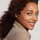 Woman wearing fitglow lip color serum in Au