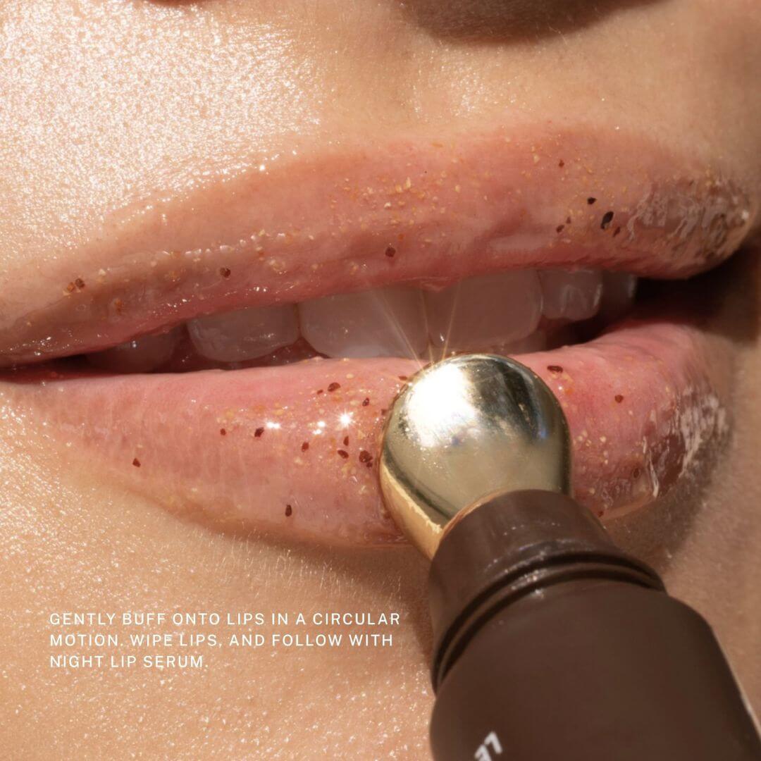 Fitglow lip scrub being applied to lips with text instructions.