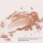 Fitglow Illuminating bronze makeup powder with neutral rose and peach undertones on a light background.