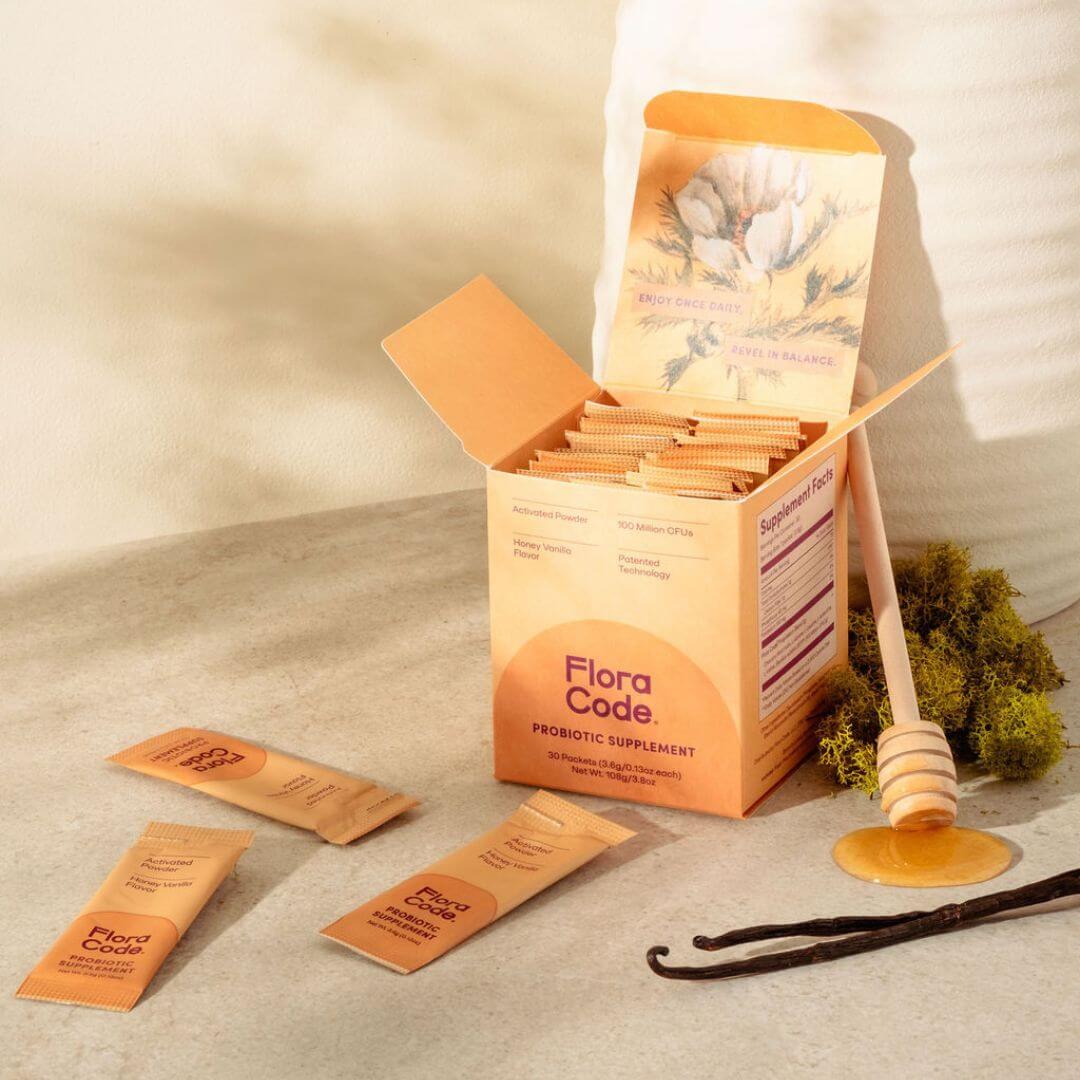 Flora Code probiotic supplement packaging on a neutral background
