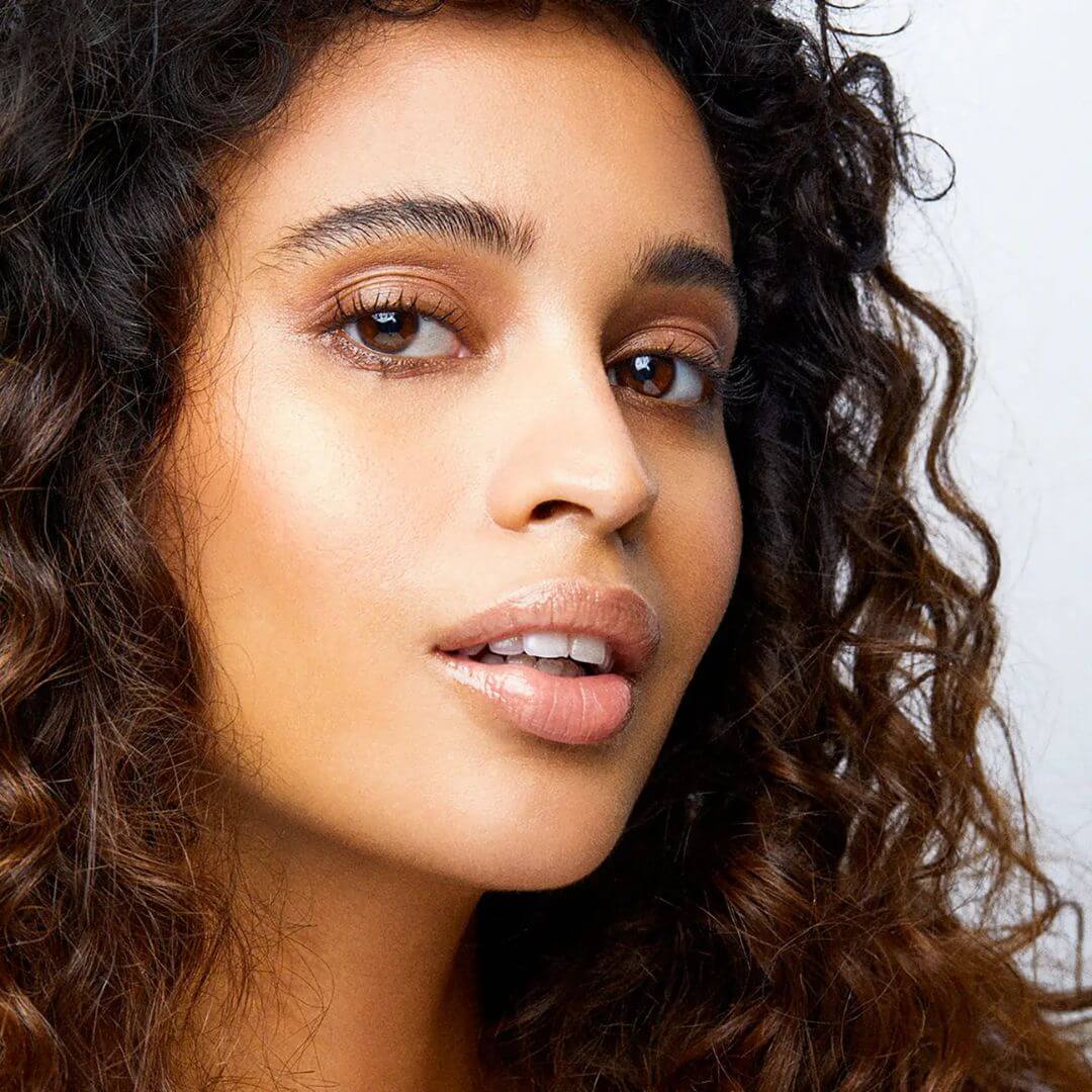Kari Gran clear Lip Whip Lip Balm close up on model