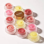 Set of Kari Gran Lip Whip lip balm containers 