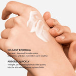 Hand applying withSimplicity body cream to another hand with product benefits text.
