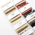 Assorted Among the Flowers bars of soap with labels on a white background
