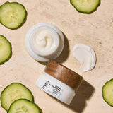 Free + True Peptide Eye Cream jars with cream and cucumber slices on a beige background