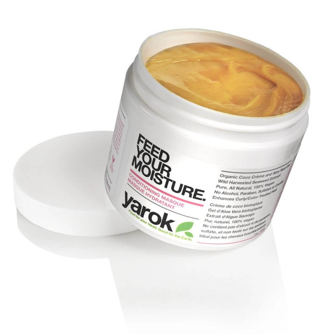 Yarok hair mask jar with open lid on a white background