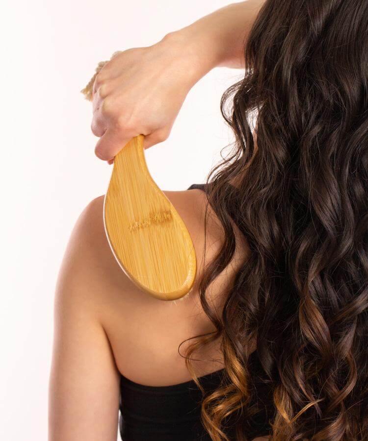 Black Chicken Remedies Garshana Dry Body Brush with person
